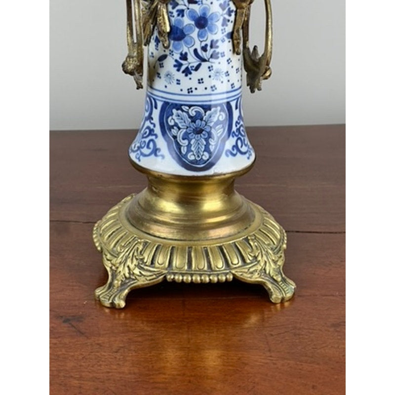 Detail of blue and white Delft decoration on antique candelabra base