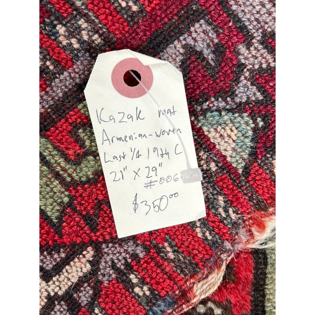 A close-up shows a handwritten price tag on an Antique Kazak Mat Woven in Armenia c. Late 19th Century, 21” x 29”, featuring red, black, and green geometric patterns; the tag lists a $350 price. Brand: None/Unknown.