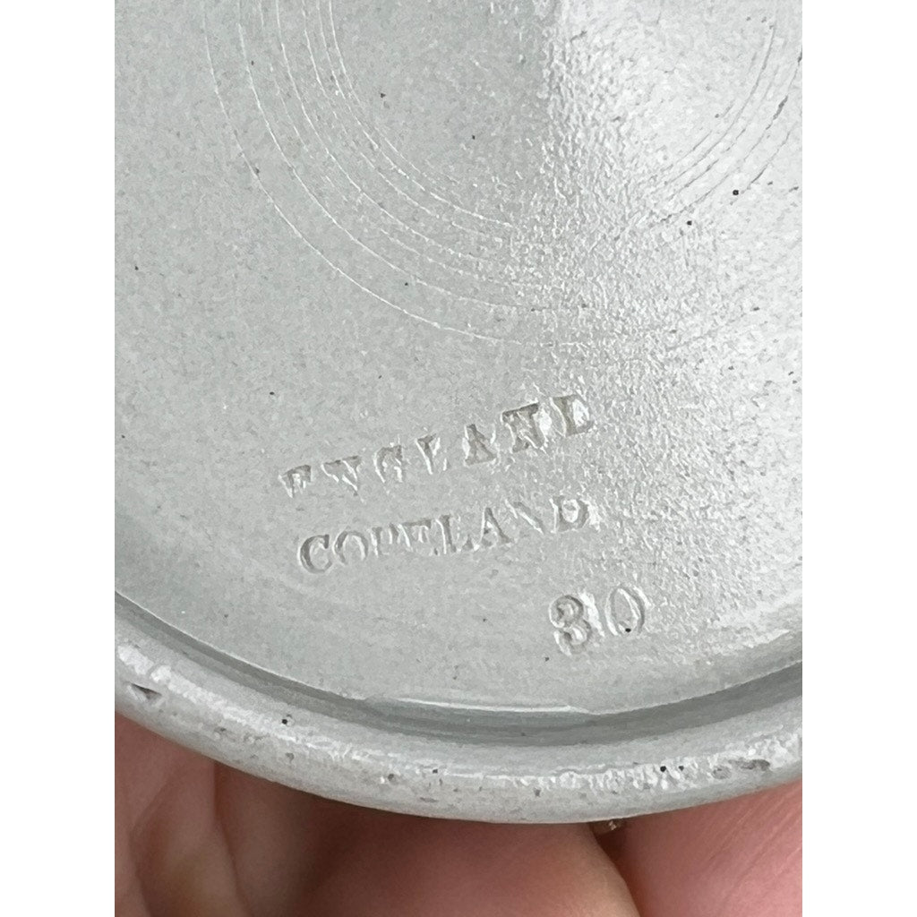 Close-up of the base of a Vintage Copeland Spode English Jasperware Fox Hunt Pitcher, showing embossed text: ENGLAND, COPELAND, and the number 30. A finger is partially visible holding this Copeland Spode piece.