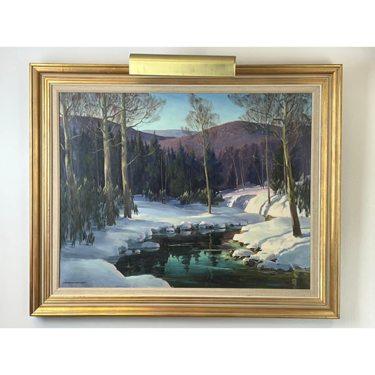 This original oil on canvas, titled “Winter’s Sinking Sun” by Edna Palmer Engelhardt (April 1963) and offered by Pearl City Antiques, features a serene snowy landscape: trees line the snow-draped ground beside a reflective stream, all set against rolling purple hills and a pale blue sky. The composition beautifully embodies Engelhardt’s signature mid-century American landscape style, capturing the tranquil warmth of winter’s sinking sun.