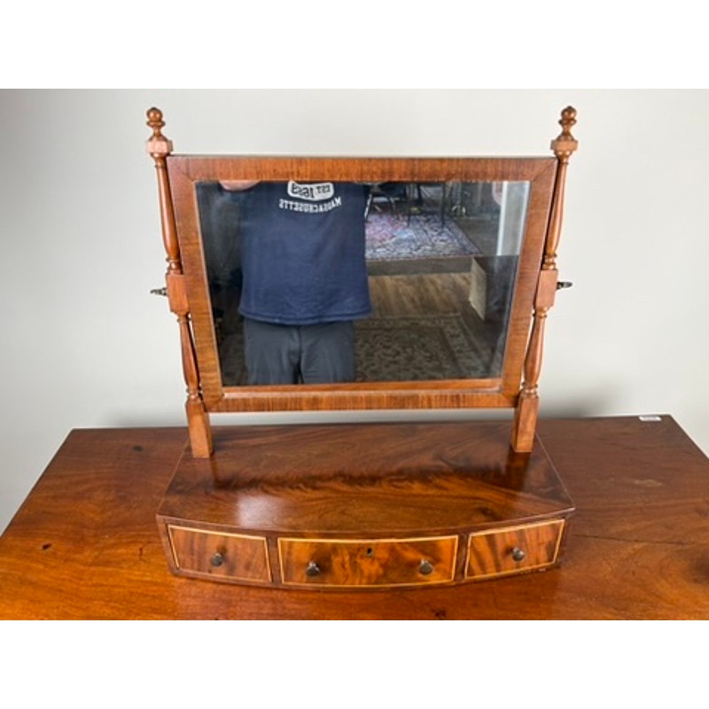 Early 19th century Federal bow front shaving mirror with turned supports