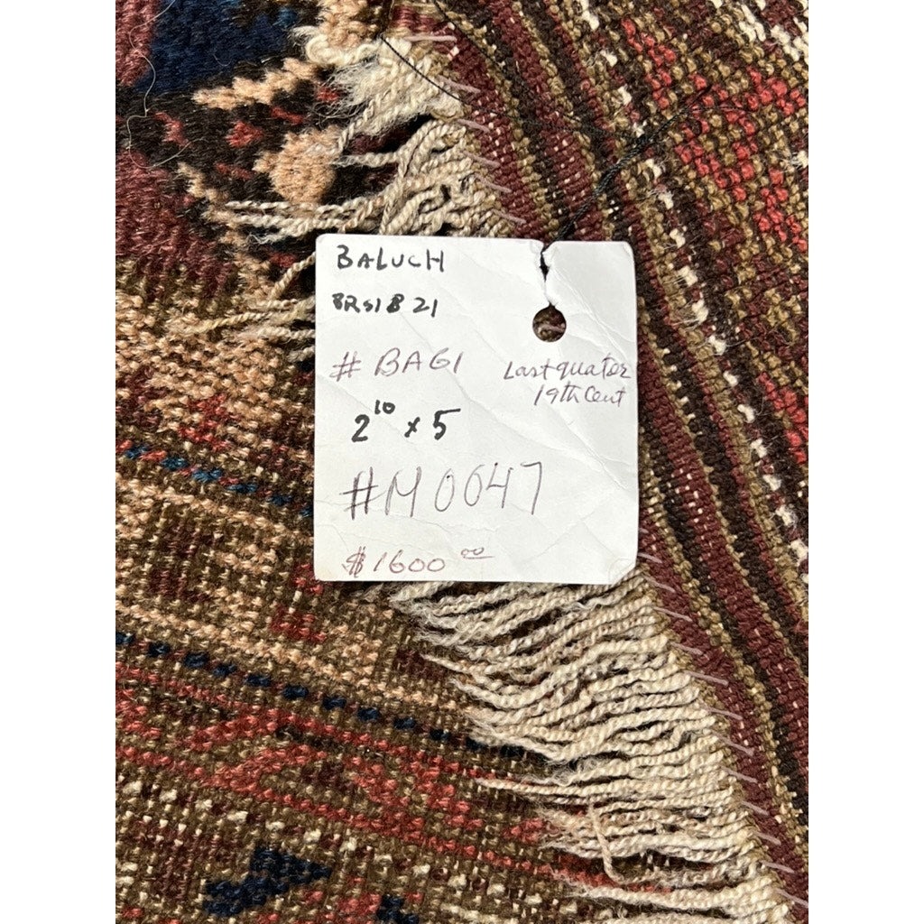 A handwritten price tag on a patterned rug reads: Antique Baluch Prayer Rug with Star Lattice Field, Northeast Persia, c. Late 19th Century – 2’10 x 5’, $1600. Features tribal symmetry in red, brown, and cream tones. Brand: Unknown.