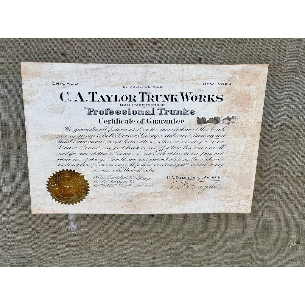 A vintage Certificate of Guarantee from CA Taylor, with decorative text, gold seal, and signatures on aged paper—once inside the C.A. Taylor Touring Trunk of John B. Cordaro, reed player for the Paul Whiteman Orchestra, c. 1930s.
