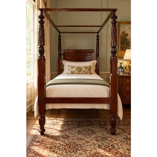 American Classical Carved Mahogany Four-Poster Tester Bed, possibly New York, circa 1825–1840, featuring carved columns and a canopy frame, dressed with a white quilt and pillows.