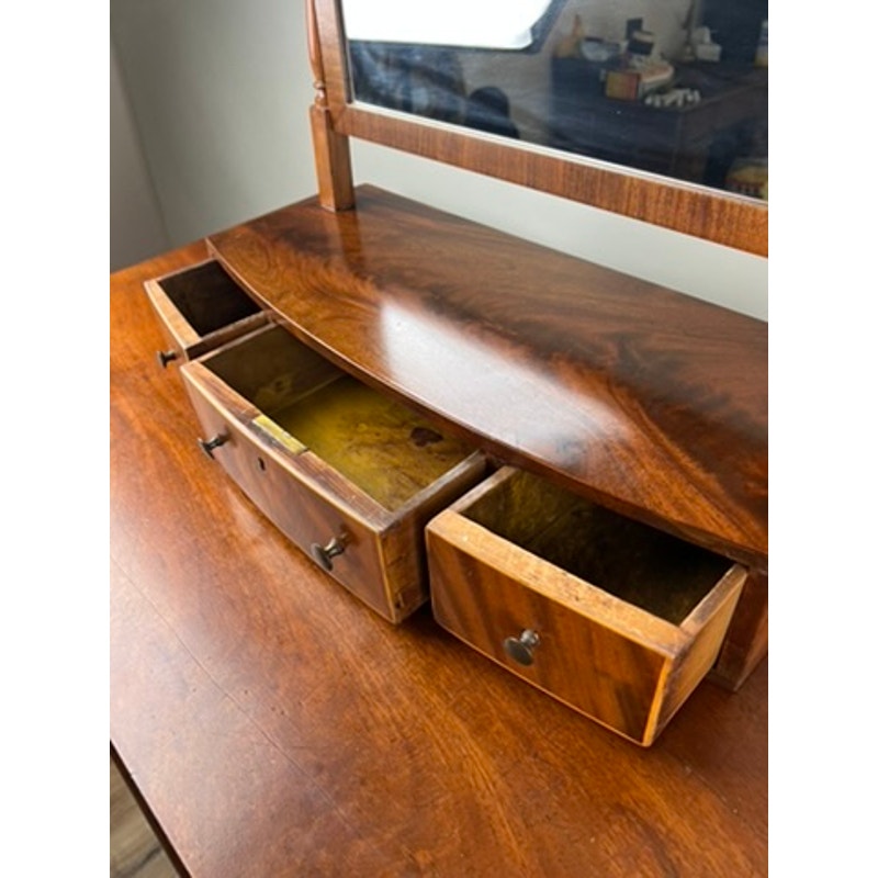Detail of bow front drawers on antique Federal shaving mirror c.1830