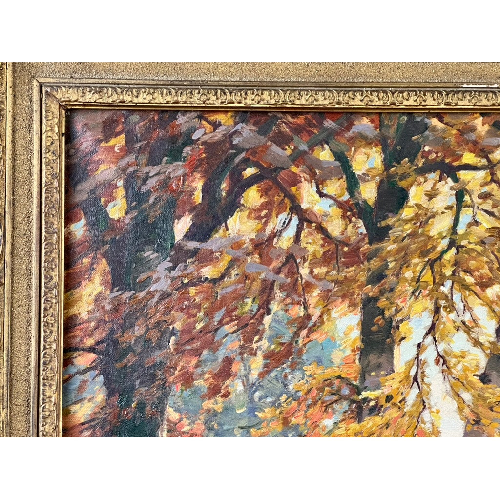 Close-up of “Path by a Stream,” an early 20th-century antique oil on canvas signed by P. Grabwin. The impressionist landscape shows autumn trees in gold, orange, and brown, partially enclosed by an ornate gold frame. Brand unknown.