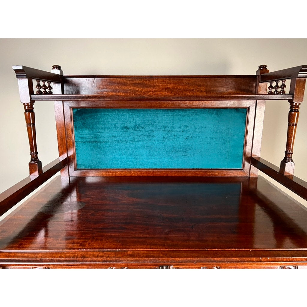 A close-up of the Antique Victorian Aesthetic Movement Mahogany Four Over Four Gentlemen’s Chest c. 1880 reveals turned posts, lattice accents, a teal velvet back, and a glossy finish true to its era. Brand is unknown.