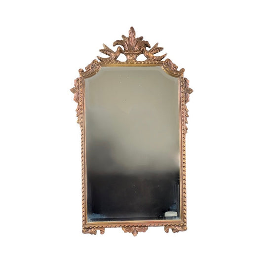The Vintage Federal Style Decorators Mirror by Pearl City Antiques features a rectangular, gold-toned ornate frame with intricate floral and leaf details, shown here against a white background.