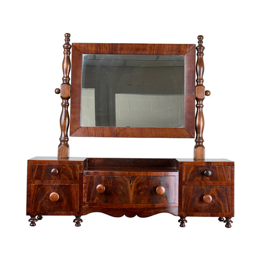 Early 19th century drop center shaving mirror with drawers and turned supports