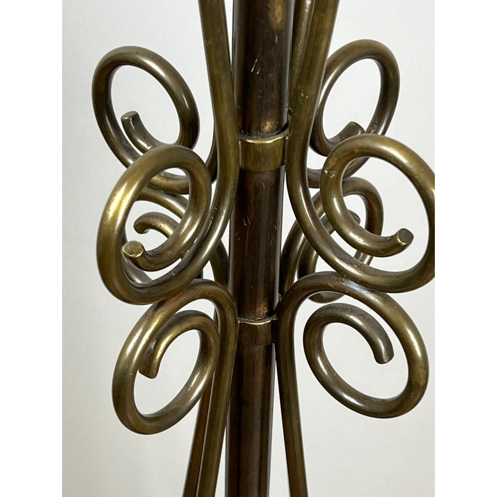 Close-up of an Antique Art Nouveau Brass Floor Lamp, attributed to Jules Cayette and Charles Schneider c. 1920, featuring multiple bronze spiral and curved rods arranged symmetrically around a central pole against a plain background.