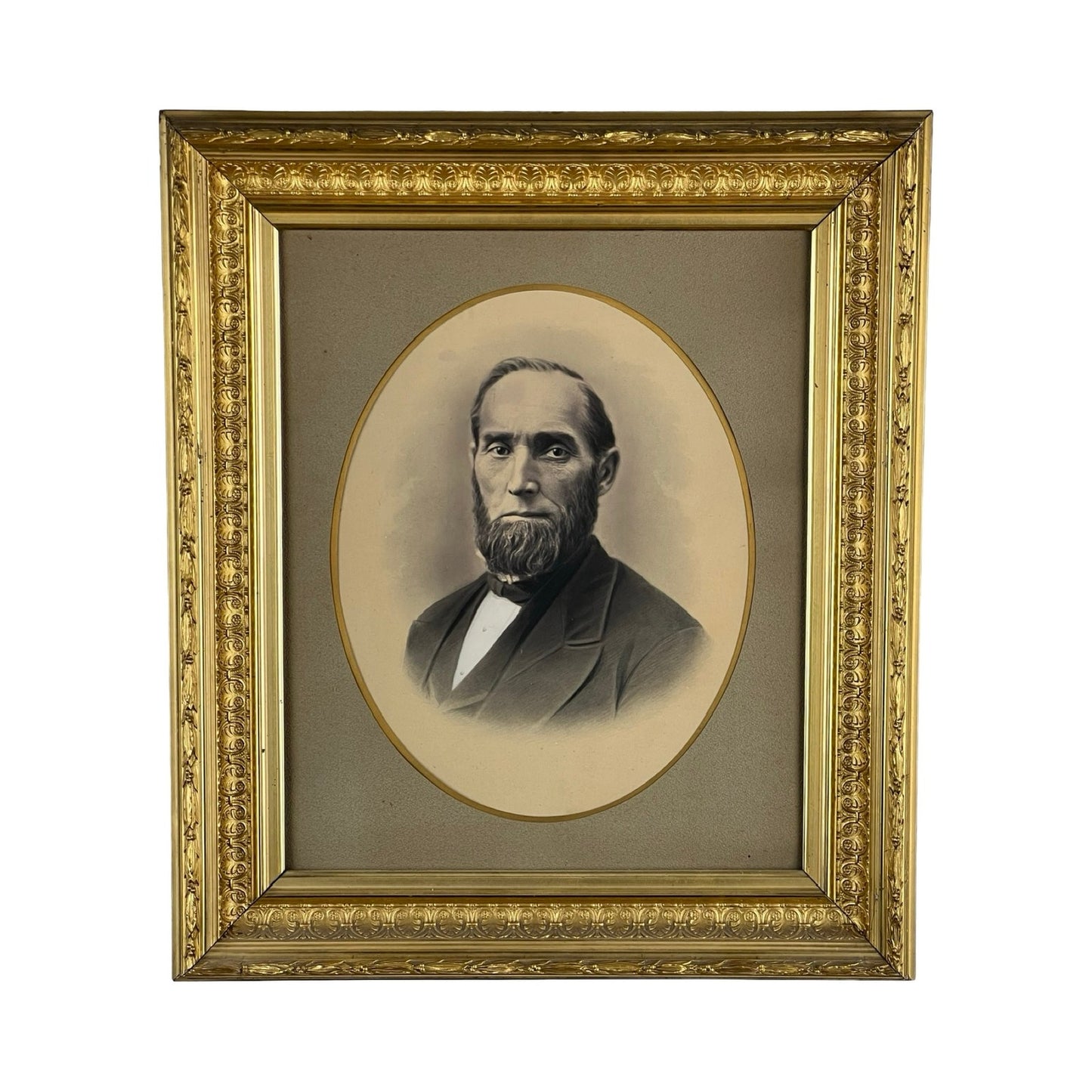 Antique Civil War Era Portrait of a Gentleman in an oval gilt wood frame with floral patterns; features a sepia-toned image of a bearded man in a suit and bow tie against a plain, neutral background. Brand: Unknown.