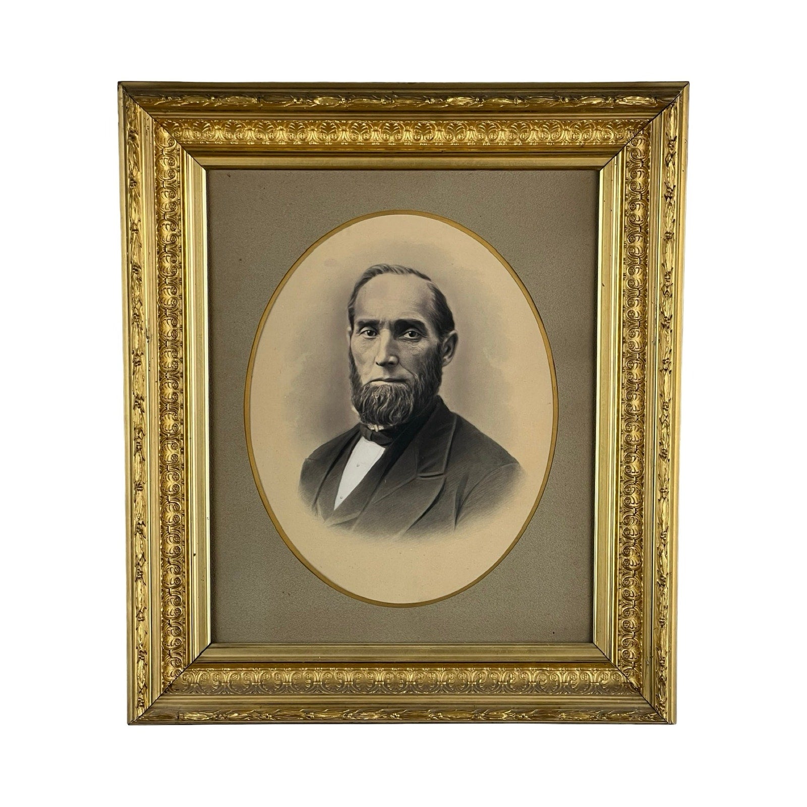 Antique Civil War Era Portrait of a Gentleman in an oval gilt wood frame with floral patterns; features a sepia-toned image of a bearded man in a suit and bow tie against a plain, neutral background. Brand: Unknown.