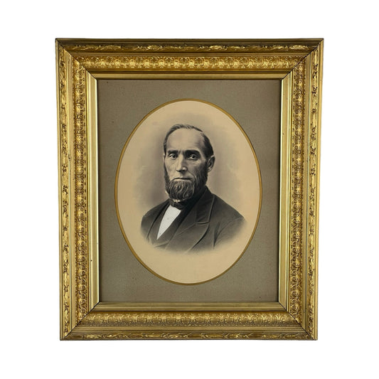 Antique Civil War Era Portrait of a Gentleman in an oval gilt wood frame with floral patterns; features a sepia-toned image of a bearded man in a suit and bow tie against a plain, neutral background. Brand: Unknown.