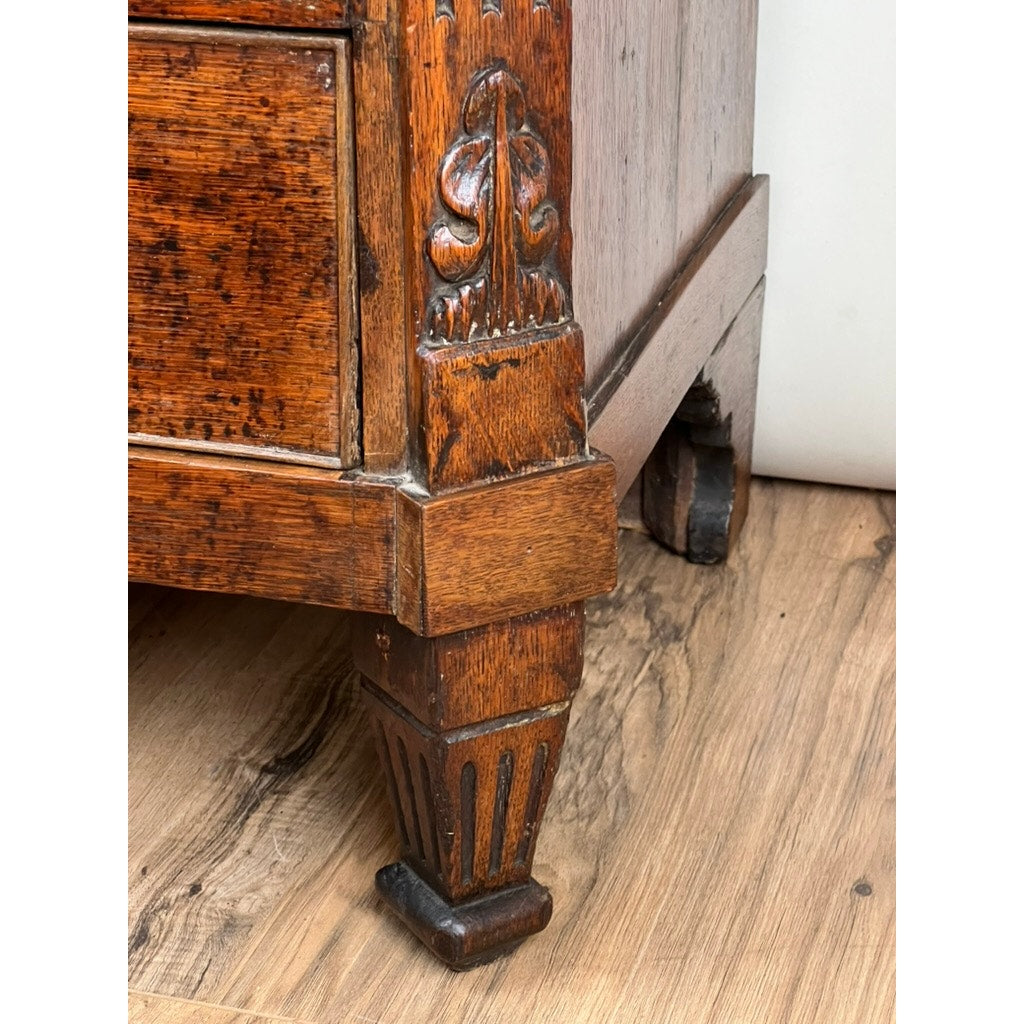 Detail of oak drawers with Louis XVI styling on late 18th century bachelors chest