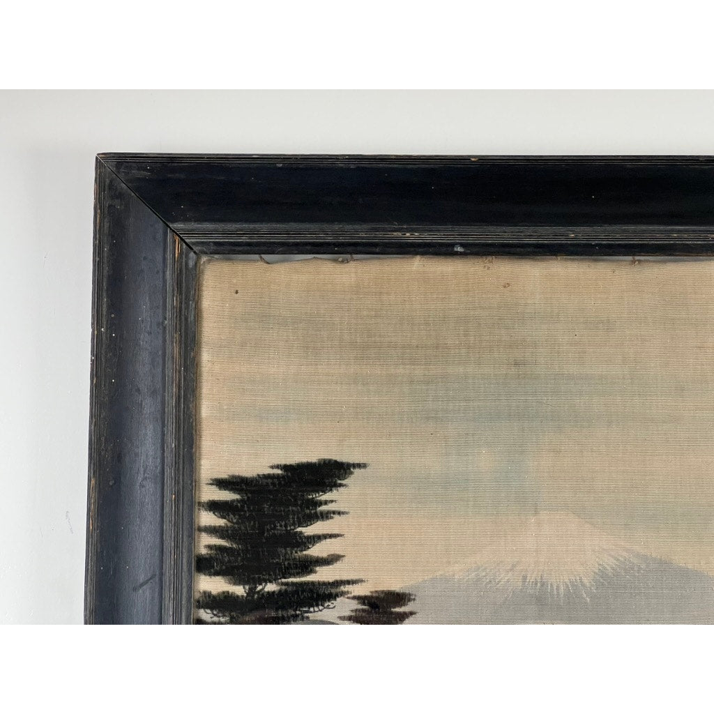 Close-up of the top left corner of a Japanese Meiji Period Embroidered Painting attributed to Nishimura Sozaemon of Kyoto, featuring a black wooden frame and landscape with tree silhouettes and a snow-capped mountain against a pale sky.
