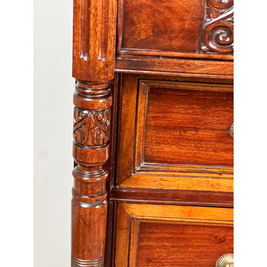 Close-up of an Antique Victorian Aesthetic Movement Mahogany Four Over Four Gentlemen’s Chest c. 1880 showing ornate carved columns, detailed drawer fronts, polished reddish-brown finish, and brass handles. Brand: Unknown.
