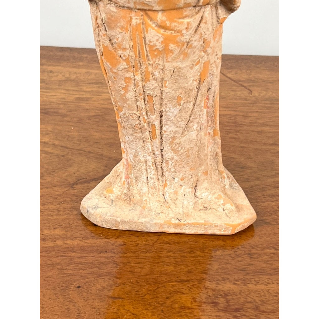 Base and lower half of an Antique Chinese Tang Dynasty (618-907 AD) Terracotta Figure of a Standing Court Lady with COA, featuring a rough, worn surface with visible cracks and faded details, resting on a wooden surface. Brand unknown.