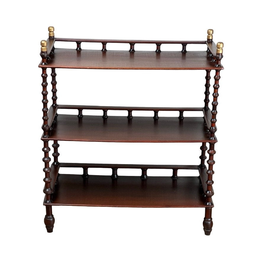 The Vintage Bobbin-turned, Three Shelf Wooden étagère or Whatnot features three open, evenly spaced tiers with turned legs, spindles, and brass finials on each top shelf corner for classic display style. Brand: None/Unknown.