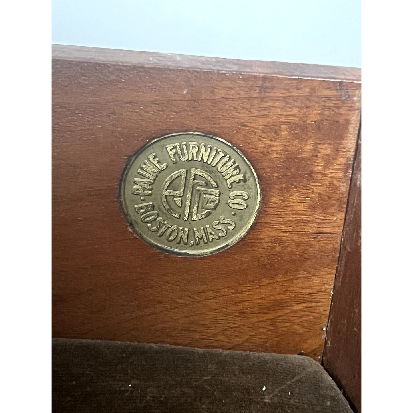 A round brass plaque set in the corner of this Vintage Federal Style Bow Front Mahogany Sideboard reads “Paine Furniture Co. Boston, Mass.”.