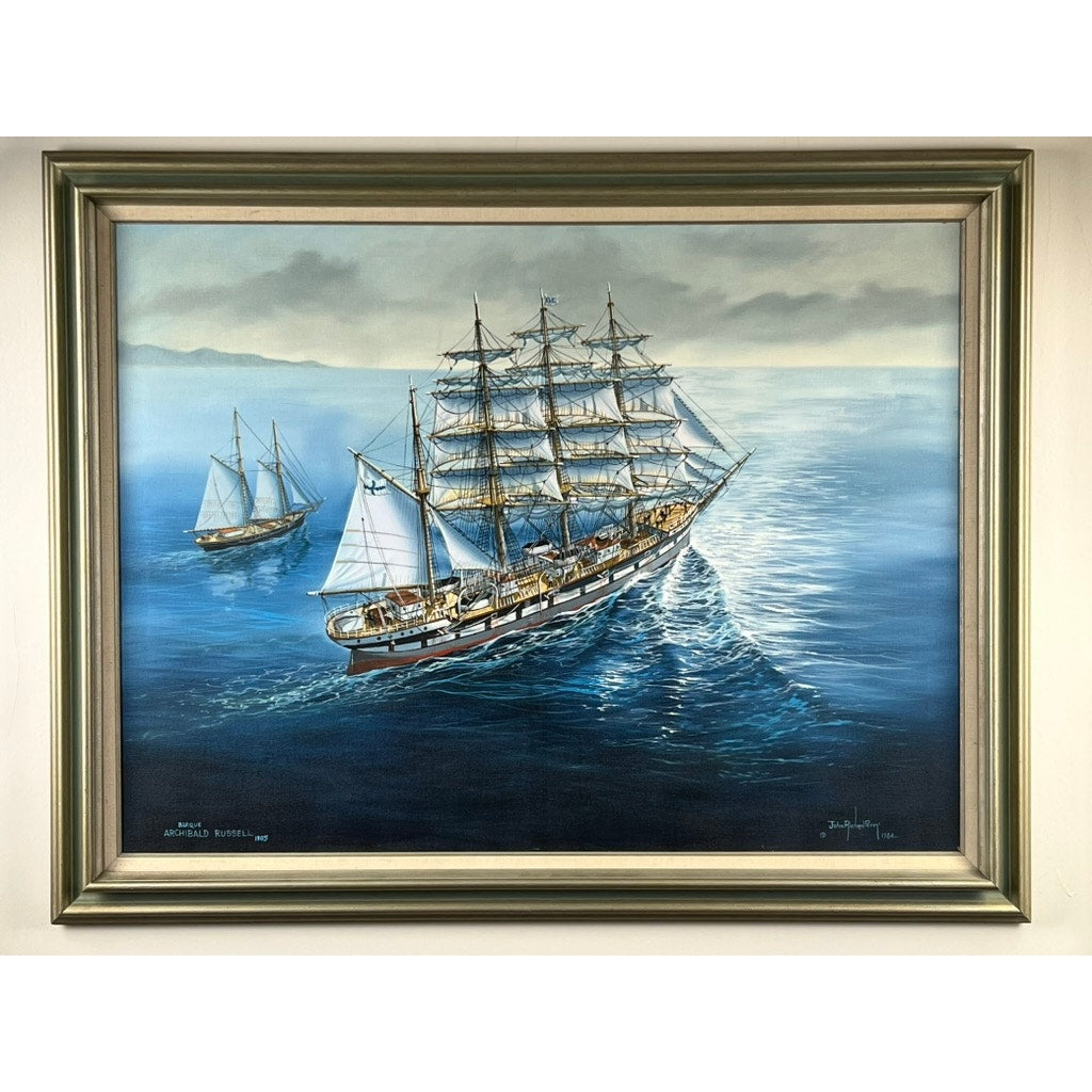 “Barque Archibald Russell 1905” is an oil on canvas painting by John Richard Perry (ME, 1984), signed lower right, depicting two large sailing ships on a calm blue ocean beneath a cloudy sky with sunlight reflecting off the water.