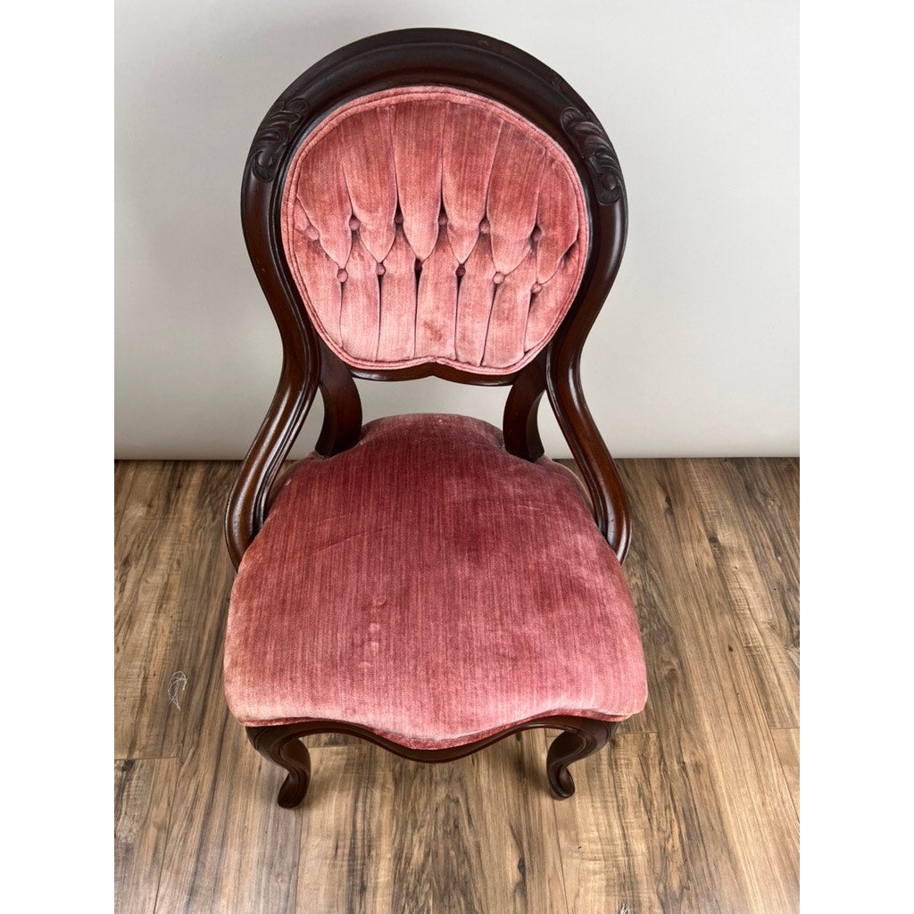 Antique Victorian Walnut Tufted Balloon Back Side Chair, late 19th century, with a carved walnut frame and pink tufted velvet upholstery on the rounded back and seat, is shown on a wood floor against a plain light wall. Brand: Unknown.