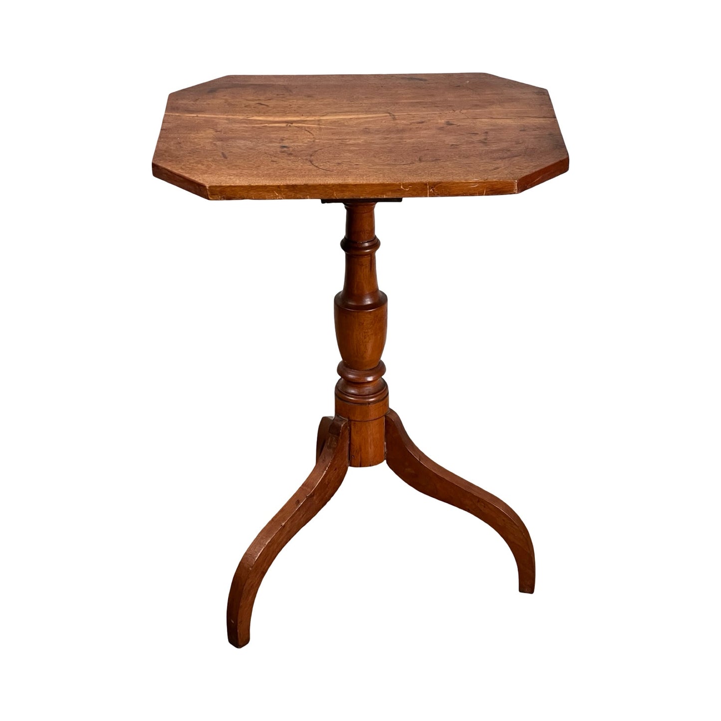 An Antique 19th Century Cut Corner Hepplewhite Candle Stand with an octagonal top and single pedestal base splitting into three curved legs, shown against a white background. Brand: None/Unknown.