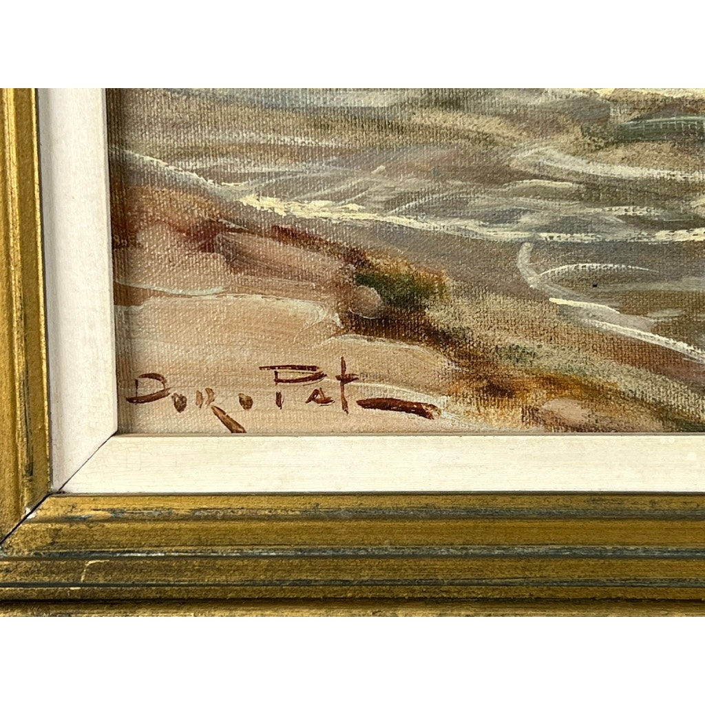 Close-up of “Two Ships Off the Beach,” an oil on canvas painting with a gold and white frame and artist's brown signature at the lower left. Abstract earthy brushstrokes suggest a vintage coastal art style. Brand: Unknown.