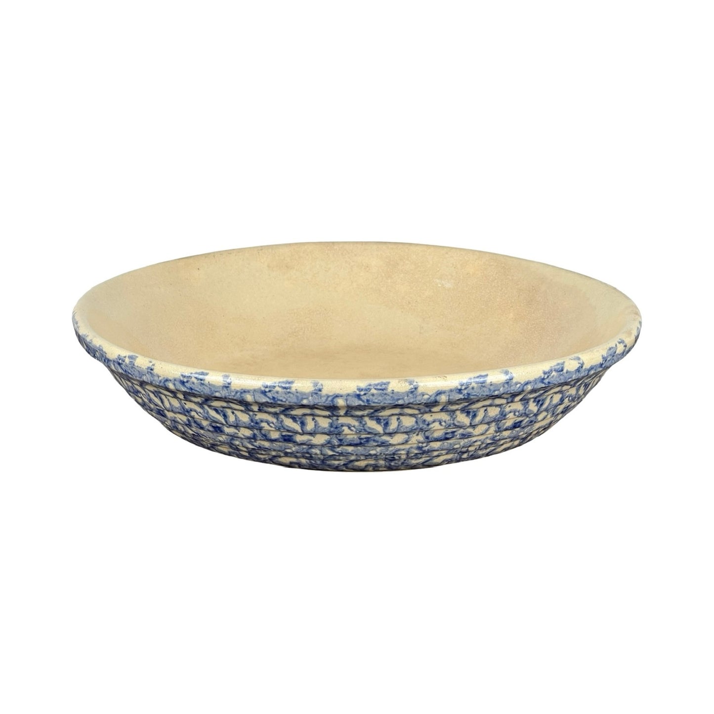 The Robinson Ransbottom Roseville Blue Spongeware Pasta Bowl features a textured blue and white exterior with a beige interior, displayed against a white background.