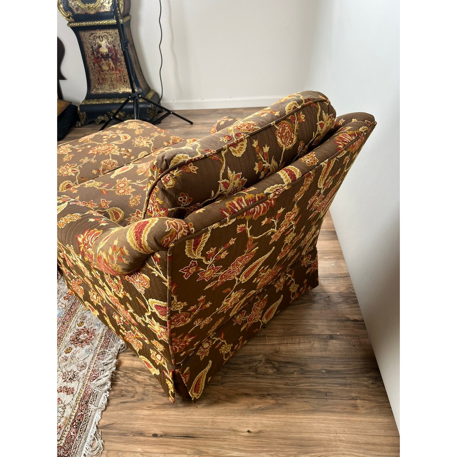 Brown and red patterned fabric on vintage club chair with ottoman