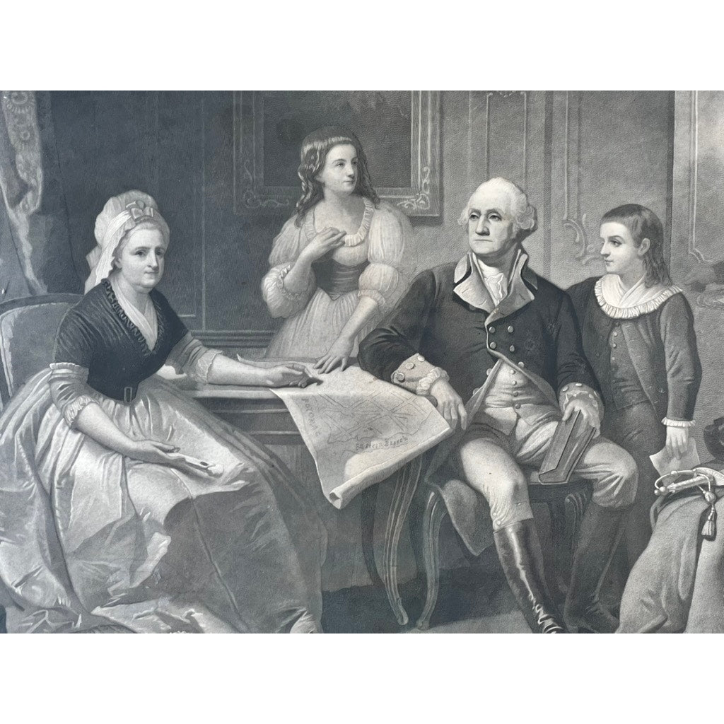 An antique black-and-white engraving titled “Washington and His Family,” published by Bradley & Co., Philadelphia, in 1858 and set in a period gilt frame, depicts four figures in period attire gathered around a table with a large map—an older gentleman resembling Washington sits holding a book, while a woman gestures to the map as two younger individuals stand nearby.