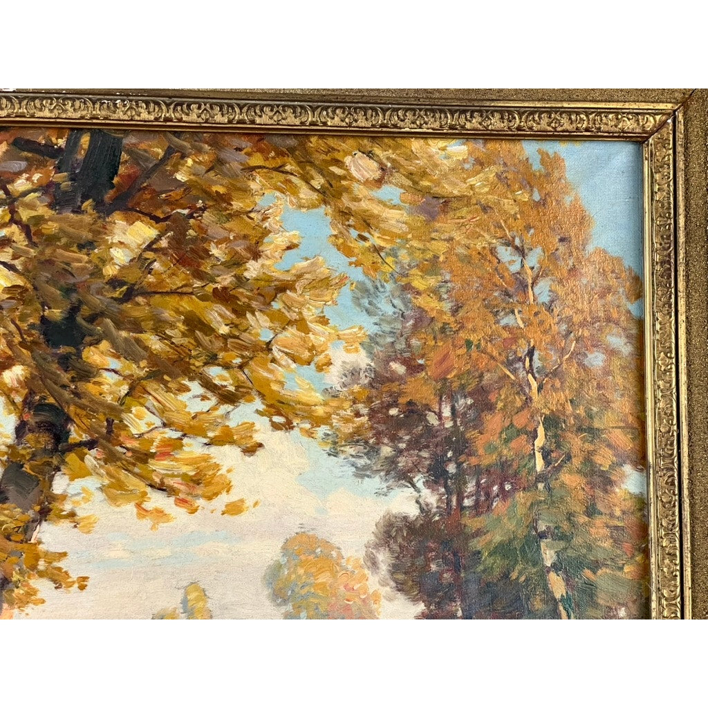 Close-up of “Path by a Stream,” an early 20th-century Impressionist oil on canvas signed P. Grabwin. Tall autumn trees with gold and orange leaves stand against a blue sky, all in an ornate gold frame. Brand unknown.