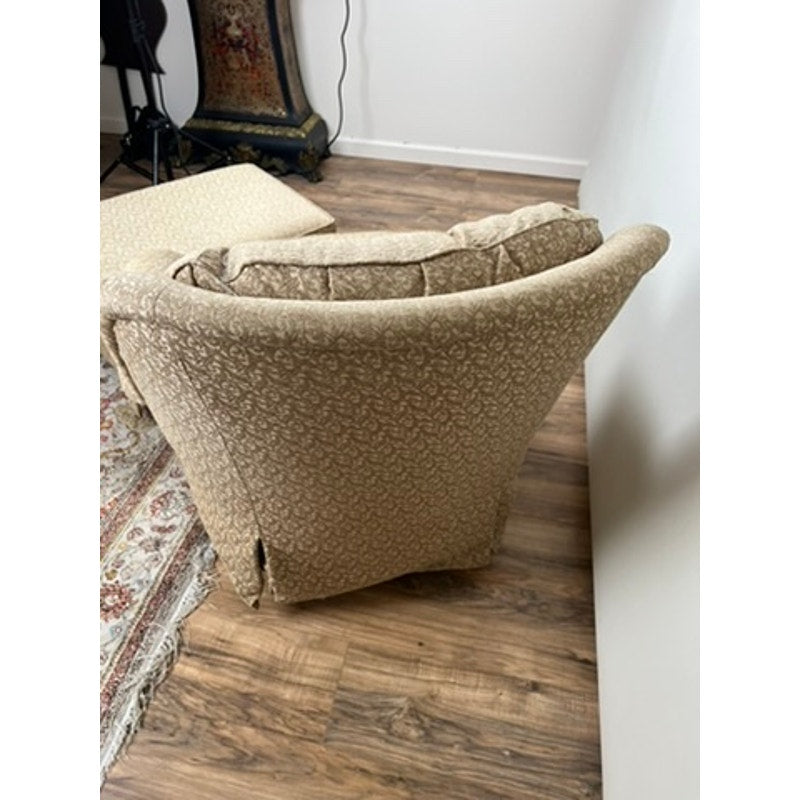 Jessica Charles rocking chair and ottoman in patterned neutral fabric
