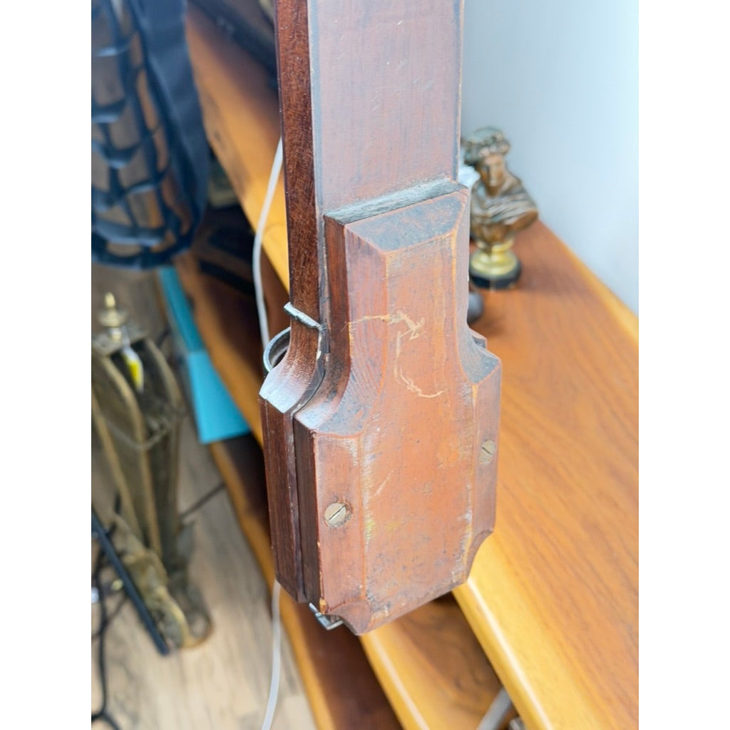 An English Regency Mahogany Stick Barometer by Thomas Jones, Liverpool, c. 1820, with a tapered, notched base held by screws.