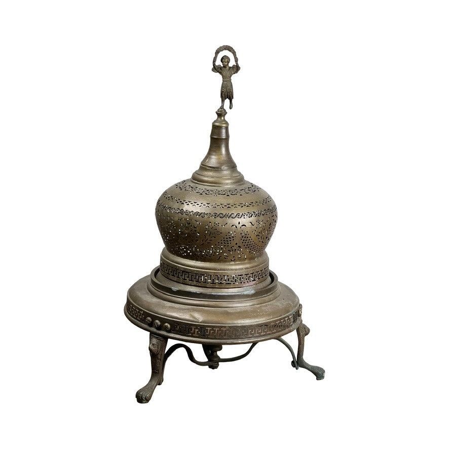 An Antique Venetian Brass Bell Room Heater Brazier c. 19th Century, featuring a dome-shaped perforated lid with a small human figurine and ornate tripod base—a unique decorative object for any space.