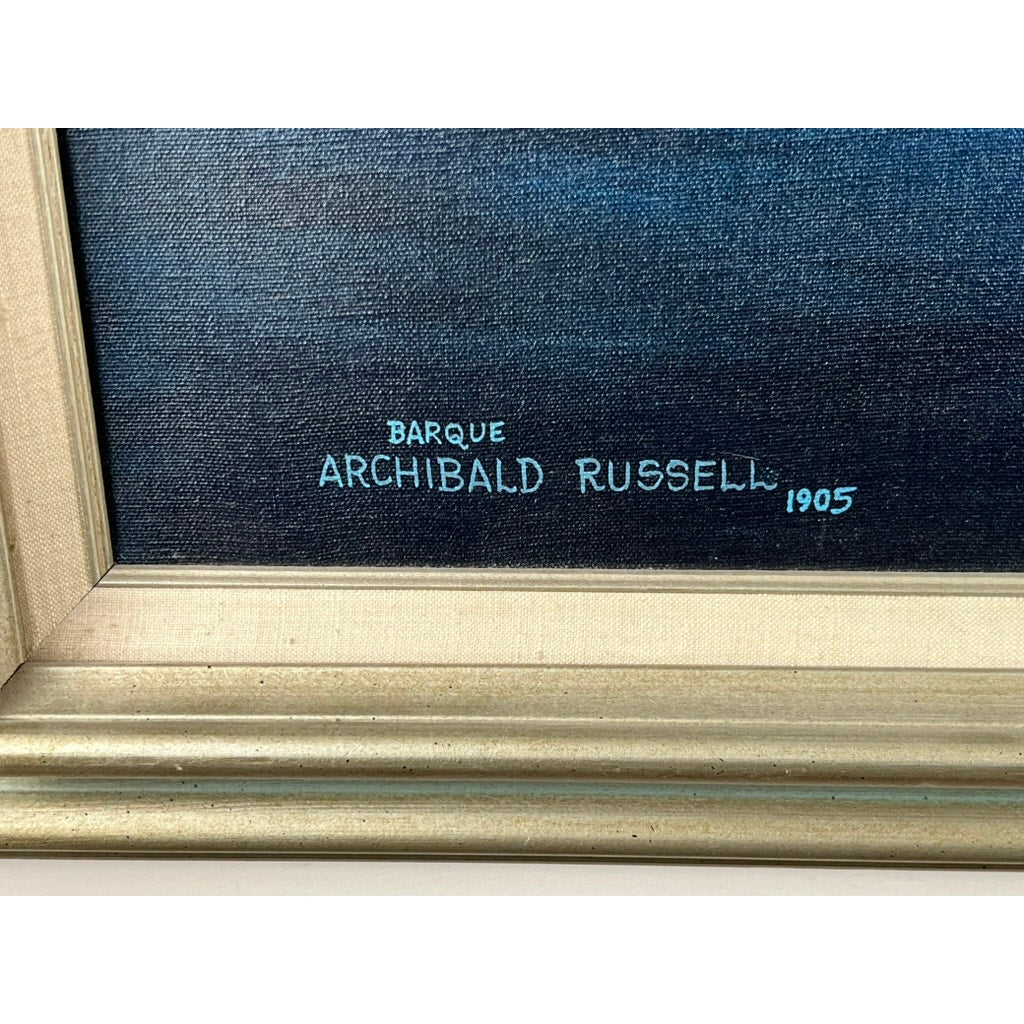 A close-up shows the gold frame and light blue signature on the lower right of “Barque Archibald Russell 1905,” an oil on canvas painting by John Richard Perry ME, 1984. Brand is unknown.