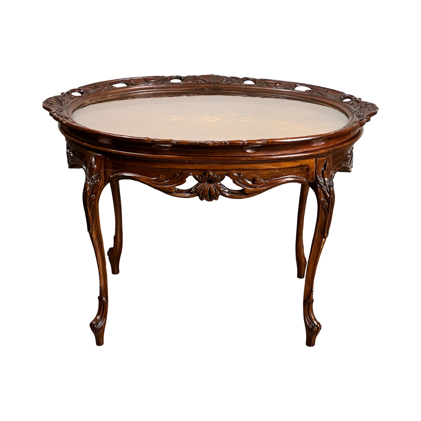 Vintage Louis XVI style butlers table with a removable glass tray, ornate round wooden design, carved details on edges and legs, and a polished surface; brand unknown; shown against a white background.