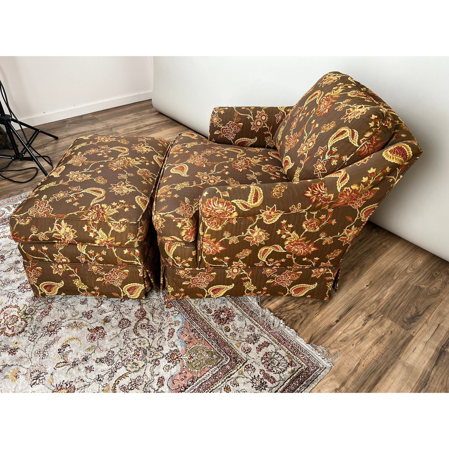 Brown and red patterned fabric on vintage club chair with ottoman
