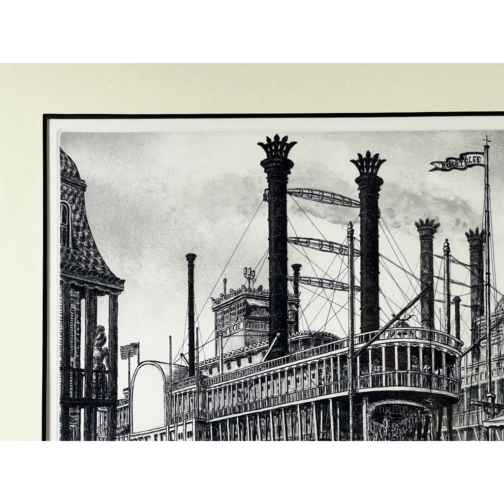Framed Etching “Steamboat Robert E. Lee” by Alan Jay Gaines: black and white illustration featuring a detailed steamboat with tall smokestacks and intricate railings docked beside a building. Brand: None/Unknown.