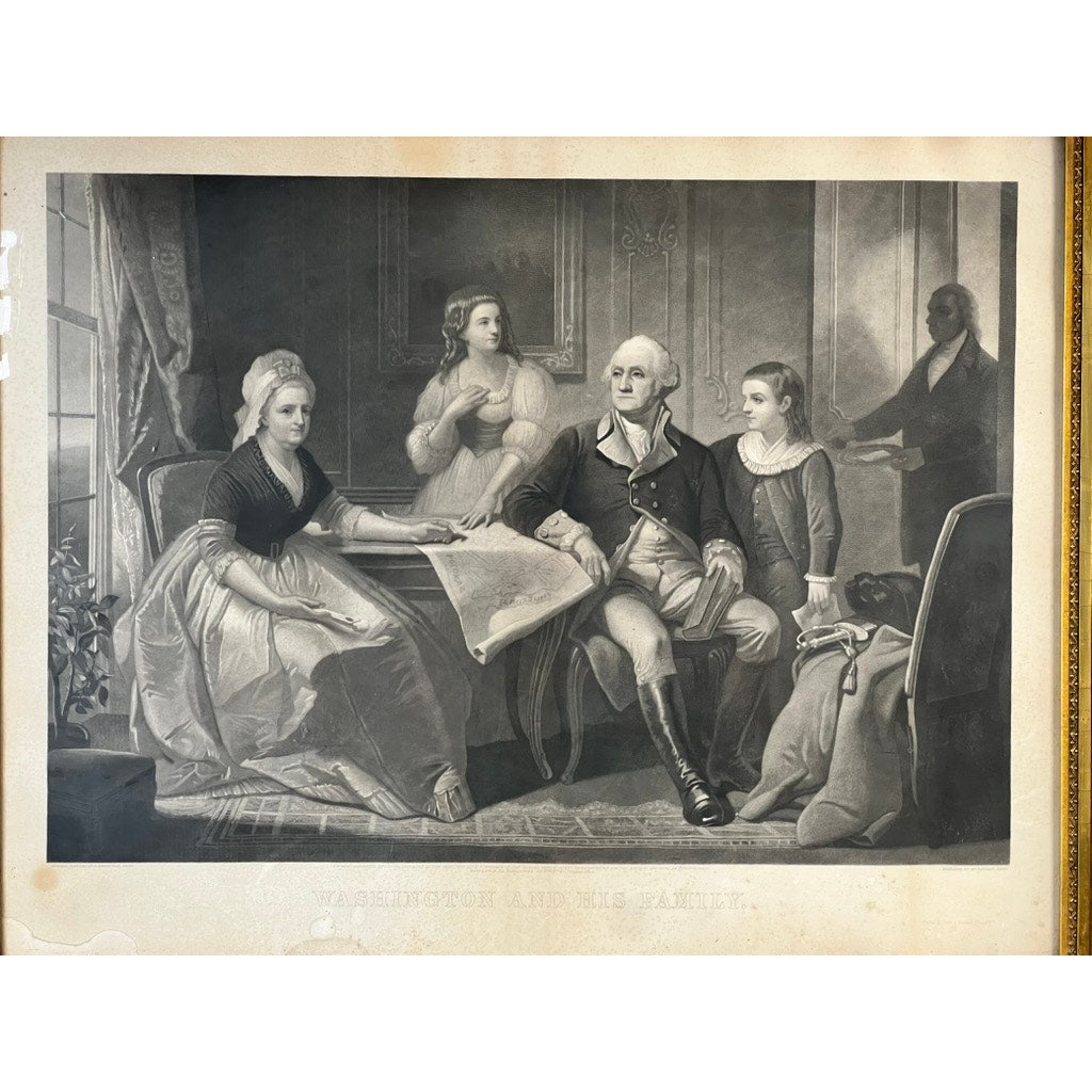 A historical engraving titled “Washington and His Family,” published by Bradley & Co., Philadelphia in 1858 and presented in a period gilt frame, depicts George Washington seated with his family in a parlor—three women and a servant appear in the background, all wearing 18th-century attire, while a map is spread on the table.