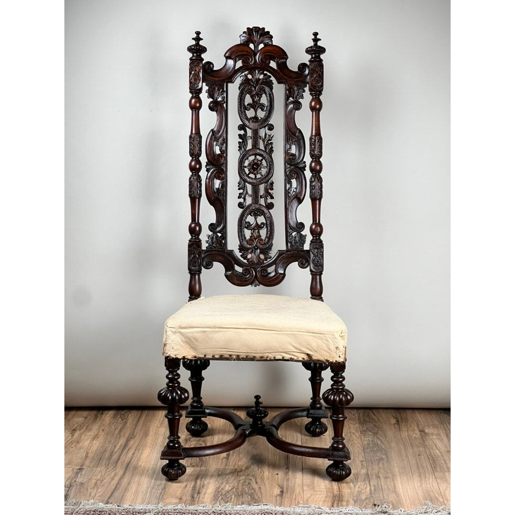 Antique Fine Carved Flemish Side Chair attr. Daniel Marot, late 17th century, features a tall ornate backrest, turned legs, and light beige upholstered seat. Displayed on a wooden floor against a plain gray background. Brand: none/unknown.