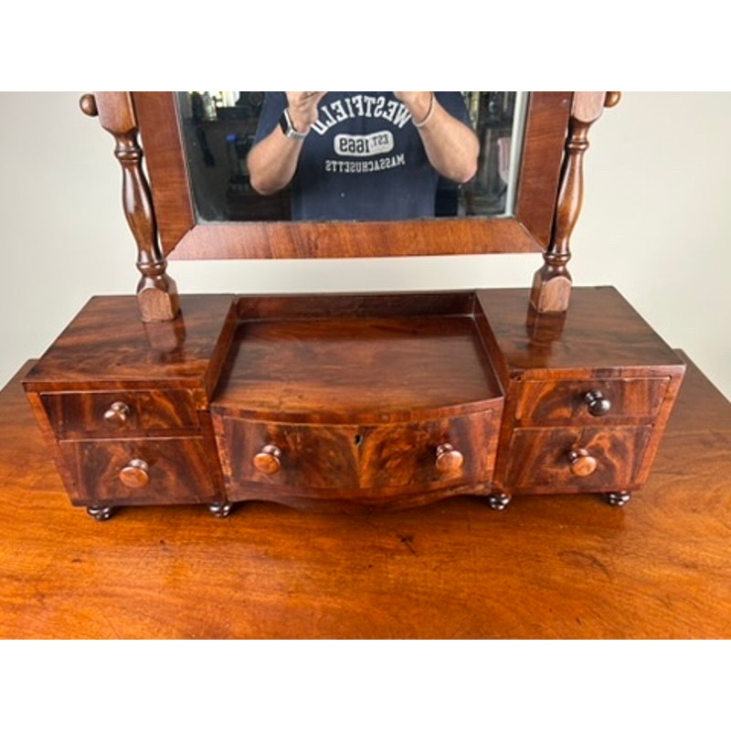 Close-up of mahogany drawers on Federal period shaving mirror