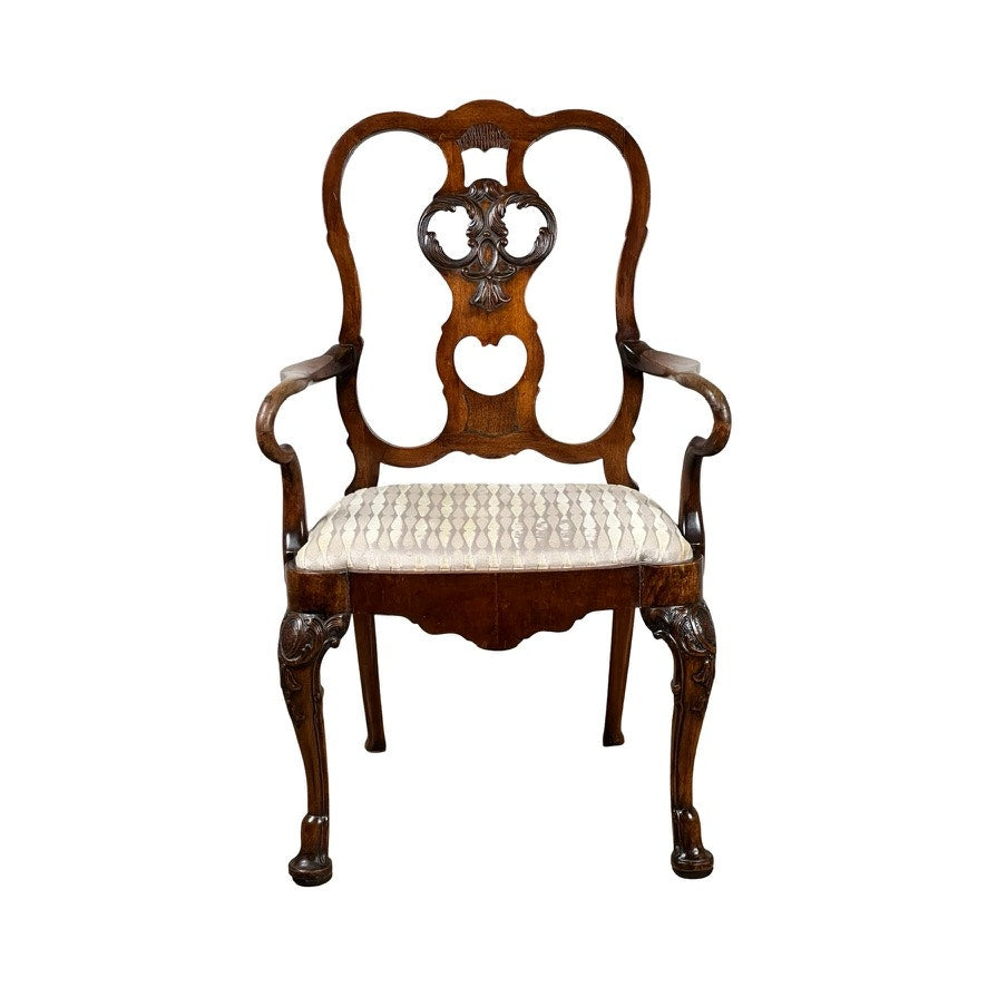 Antique George III Mahogany Open Arm Chair, late 18th century, featuring a carved backrest with heart-shaped cutout, curved arms, patterned fabric cushioned seat, and ornately carved legs. Brand: None/Unknown.