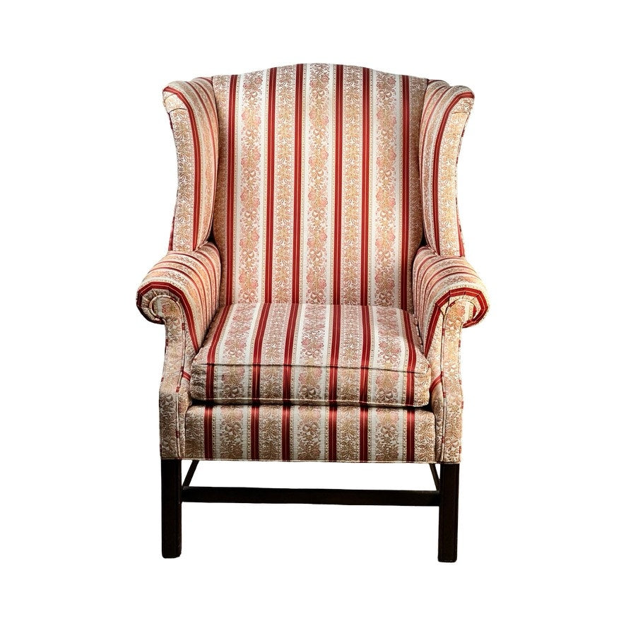 The Vintage Chippendale Style Wingback Chair by Ethan Allen features classic red, gold, and cream striped upholstery and dark wooden legs. Shown from the front against a white background.
