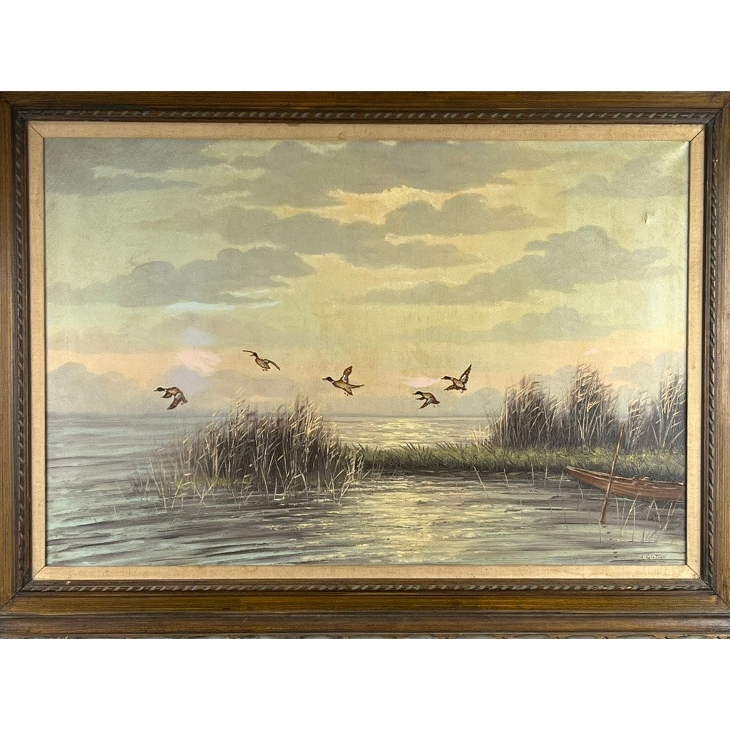 Painting Oil on Canvas 'Mallards Over Marsh' by Joseph Glotzer shows ducks over a tranquil lake at sunset with reeds, a rowboat by the shore, and clouded skies.