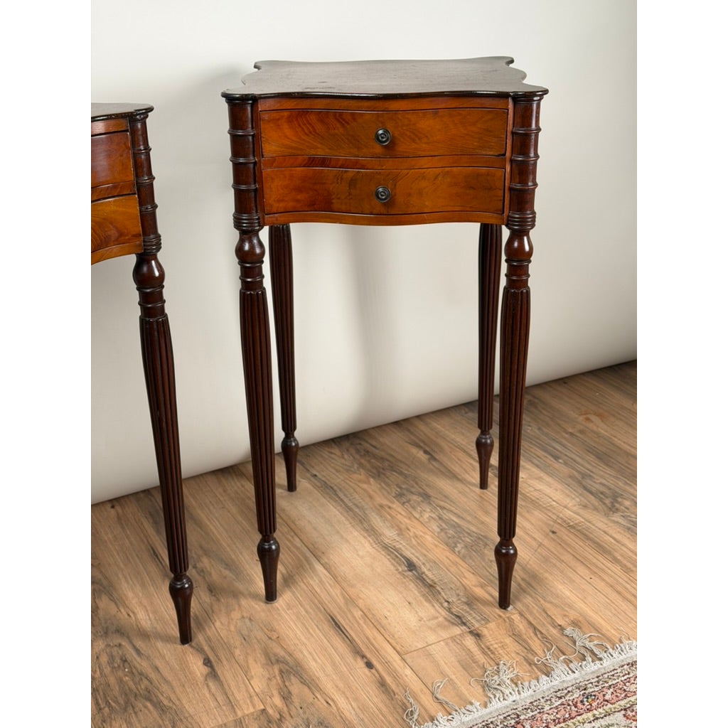 Pair of American Classical Revival Mahogany Two-Drawer Work Tables, circa 1880–1910, each featuring two drawers with circular pulls and tapered, fluted legs.