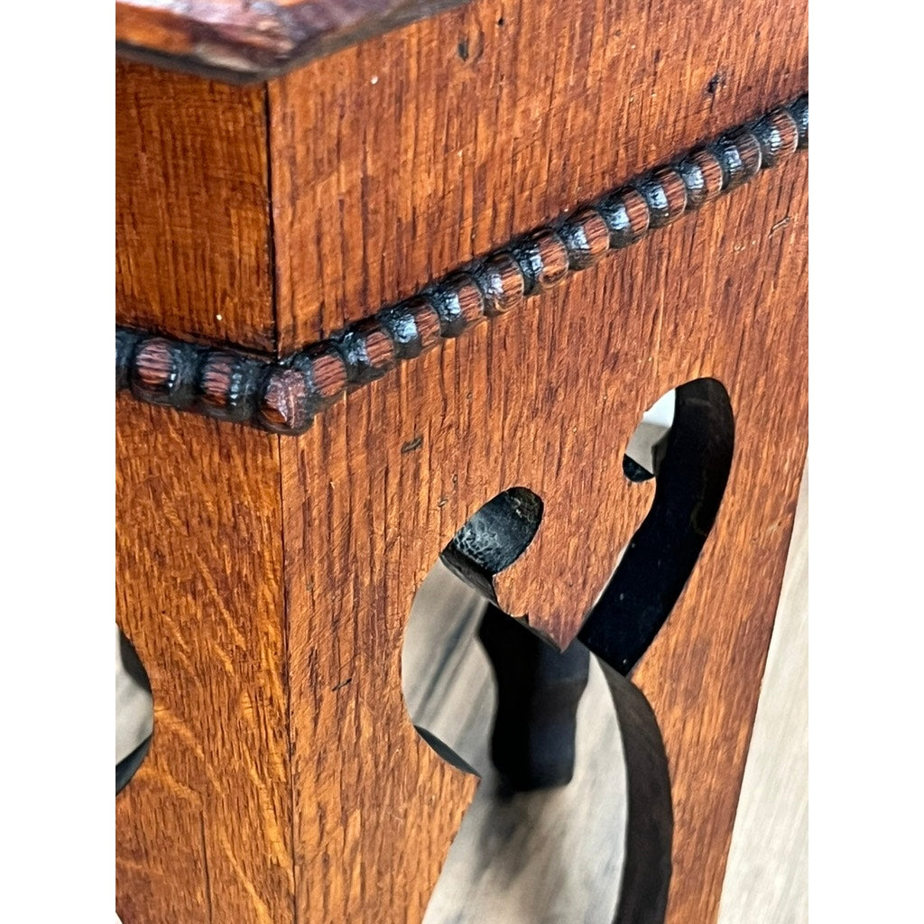 Close-up of an Antique Arts & Crafts Small Oak Occasional Table c. 1910, highlighting its dark beaded trim, decorative cutout pattern, and rich wood grain—showcasing the fine craftsmanship of early 20th-century design.