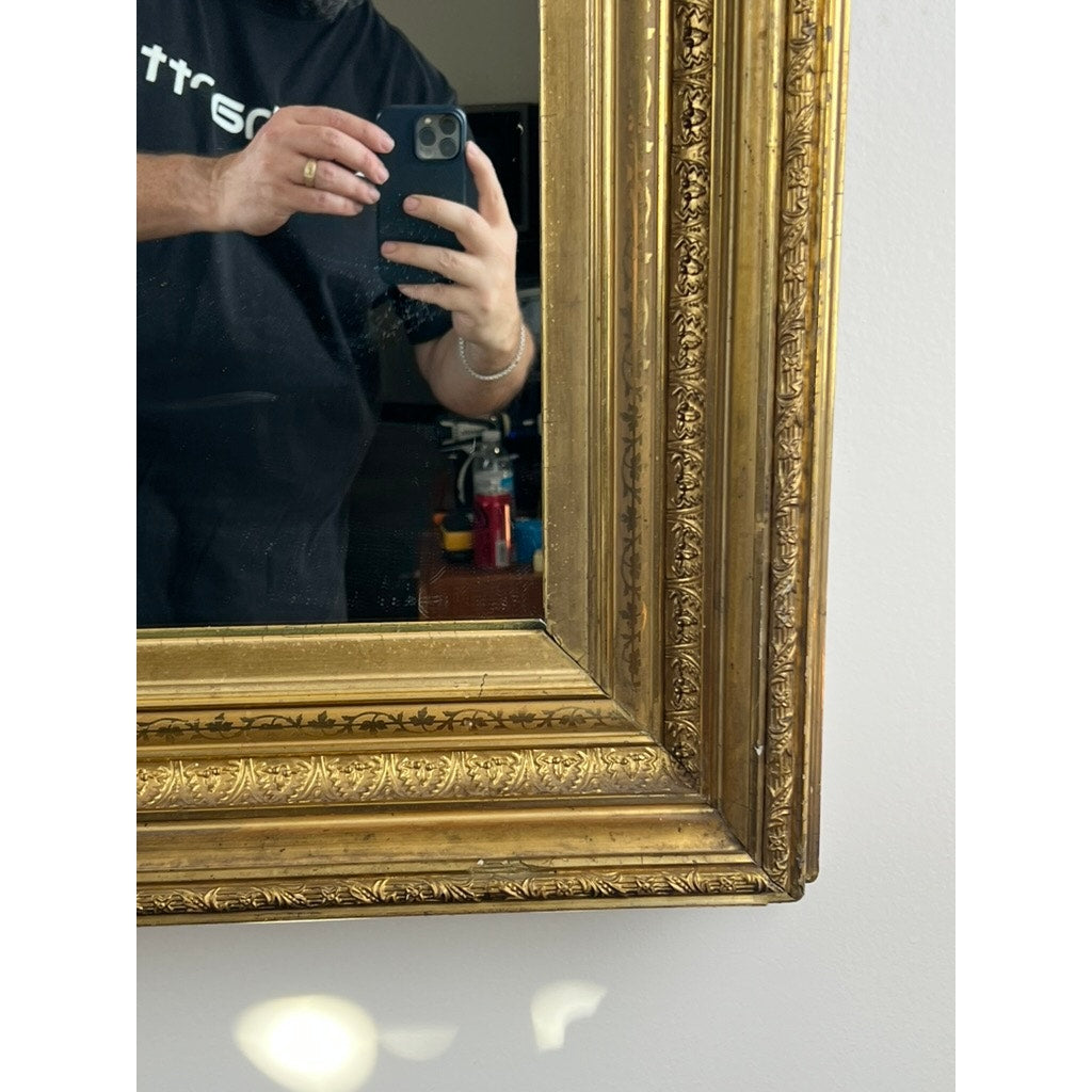 A hand holding a phone is visible in the reflection of a Fine Antique 19th Century Gilt Wood Mirror (39 x 34); the background includes household items and part of a black shirt. Brand: None/Unknown.