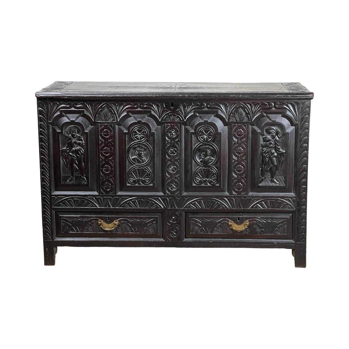An Antique 18th Century Charles II Style Mule Chest—possibly Irish or Scottish—with ornate carved human figures and floral patterns on dark wood, featuring two lower drawers with brass handles; a rare, exquisite piece.