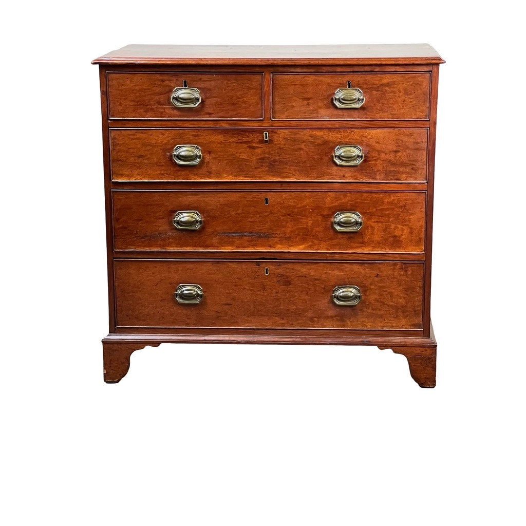 A Late Georgian English Mahogany Chest of Drawers, Circa 1780–1810, crafted in rich brown mahogany, features four drawers—two smaller ones above and two larger below—with elegant brass handles, evoking the classic charm of period English furniture.