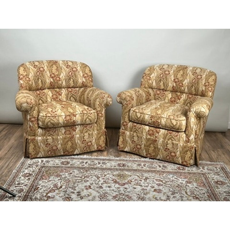 Pair of vintage upholstered club chairs, one swivel and one fixed